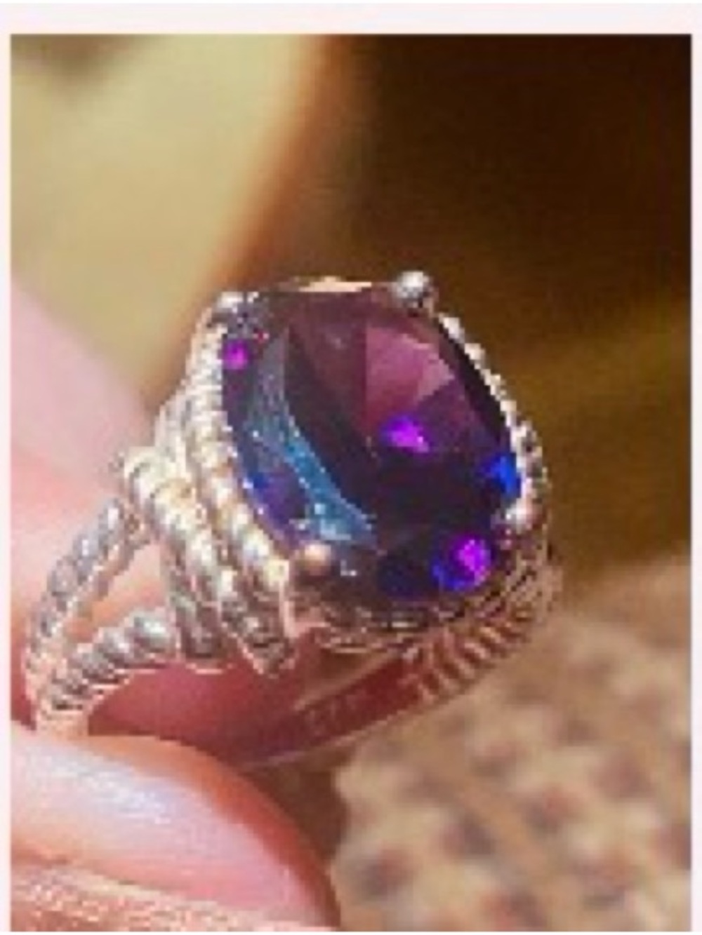 Purple Gemstone Ring set in a braided silver band. Size 7
